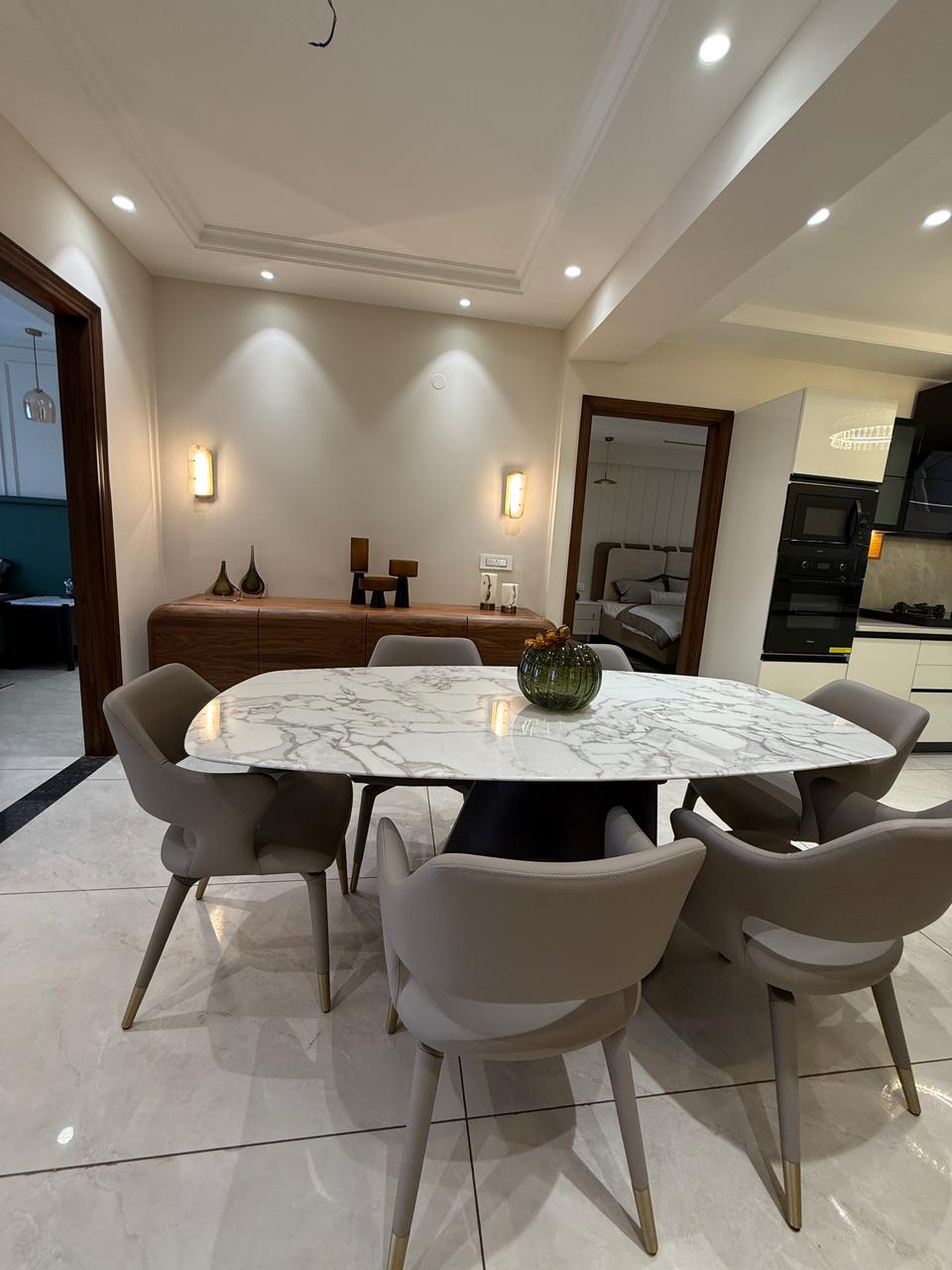 Dining, with the kitchen and bedroom beyond — The Grandeur, Sector 117 Mohali