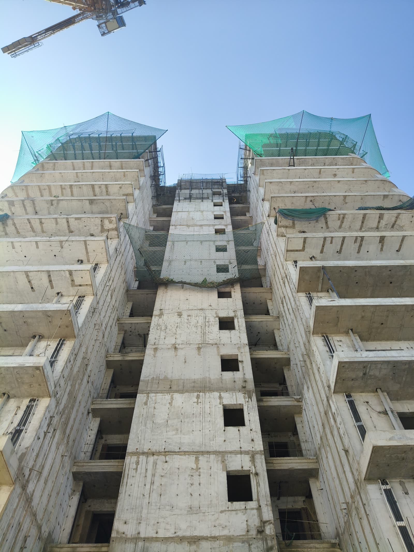 Lift core standing above the topmost slab, Highland Mayfield