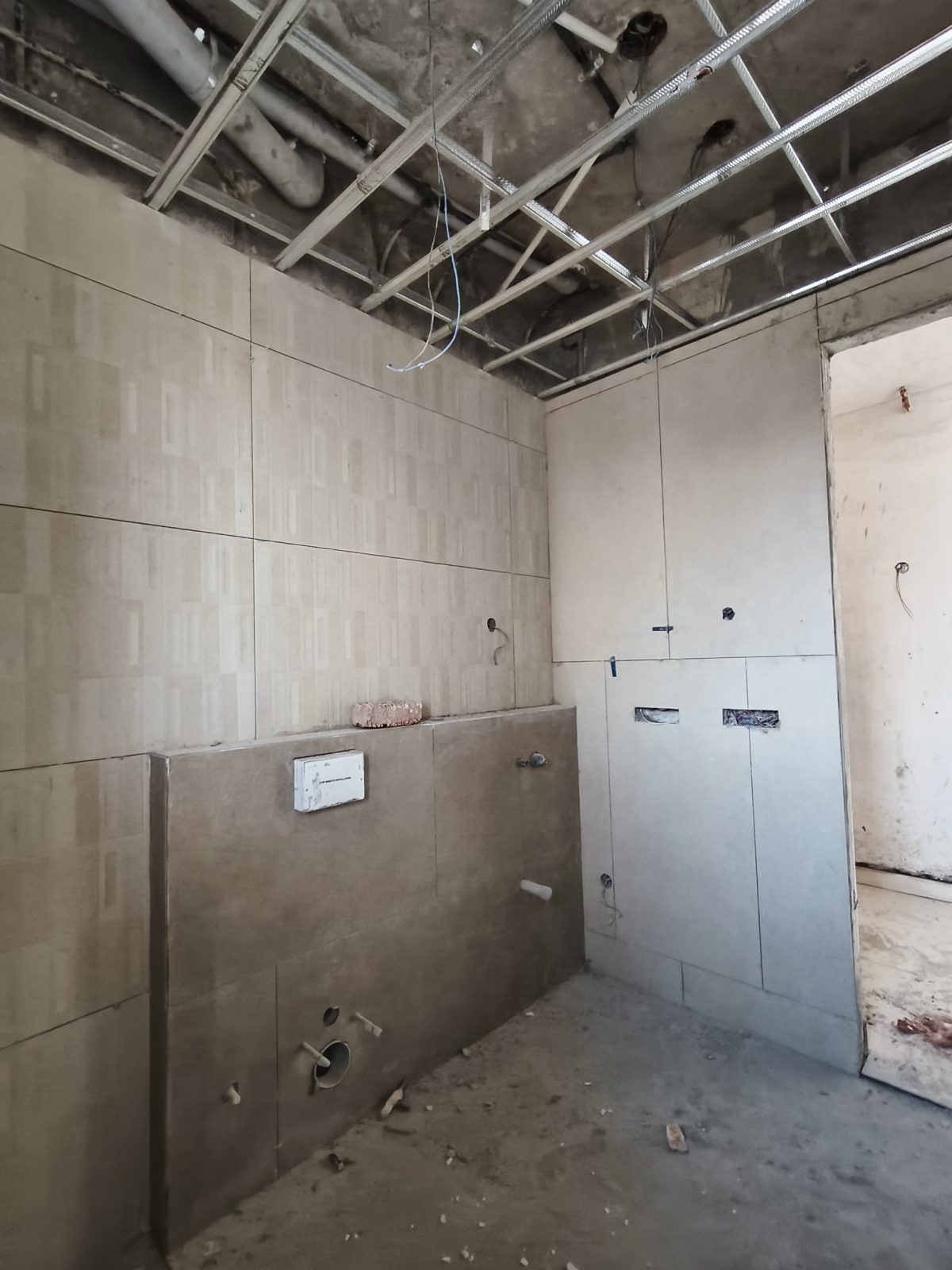 Sample flat washroom with concealed cistern frame, October 2026